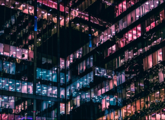 Closely huddled glass offices at night