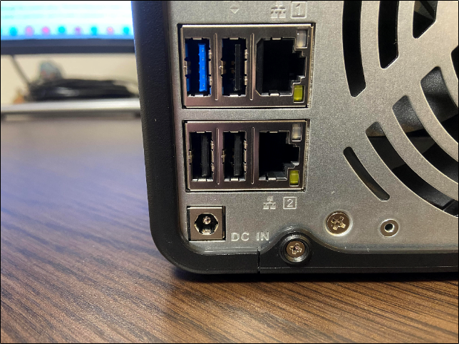 Ethernet and DC IN port on the back of a QNAP NAS