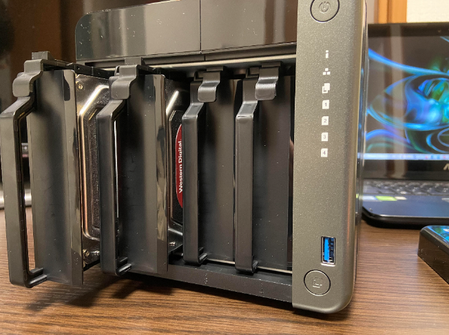QNAP NAS with two drive trays sticking out